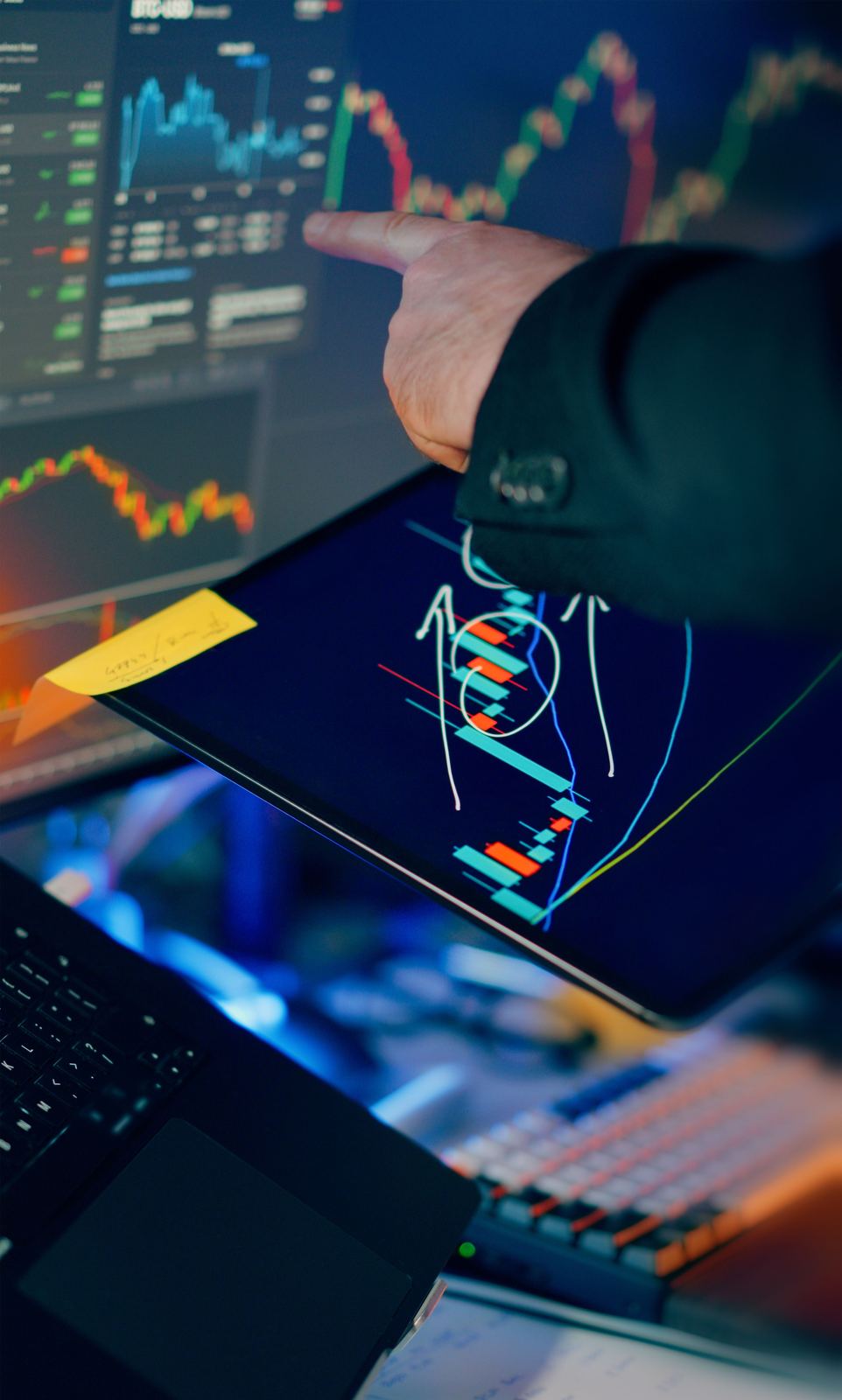 Market analyst reviewing trading data across several displays